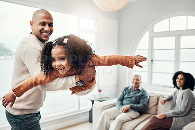 Buy stock photo Family, flying and a father playing with his daughter in the living room of their home together during a visit. Children, energy and a man having fun with his girl while bonding in a house for love