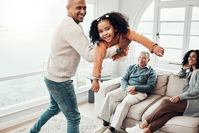 Buy stock photo Dad, daughter and airplane game in living room for portrait, happy family or comic playing for bonding. Father, child and swing for plane games in lounge with woman, men or love for holiday happiness