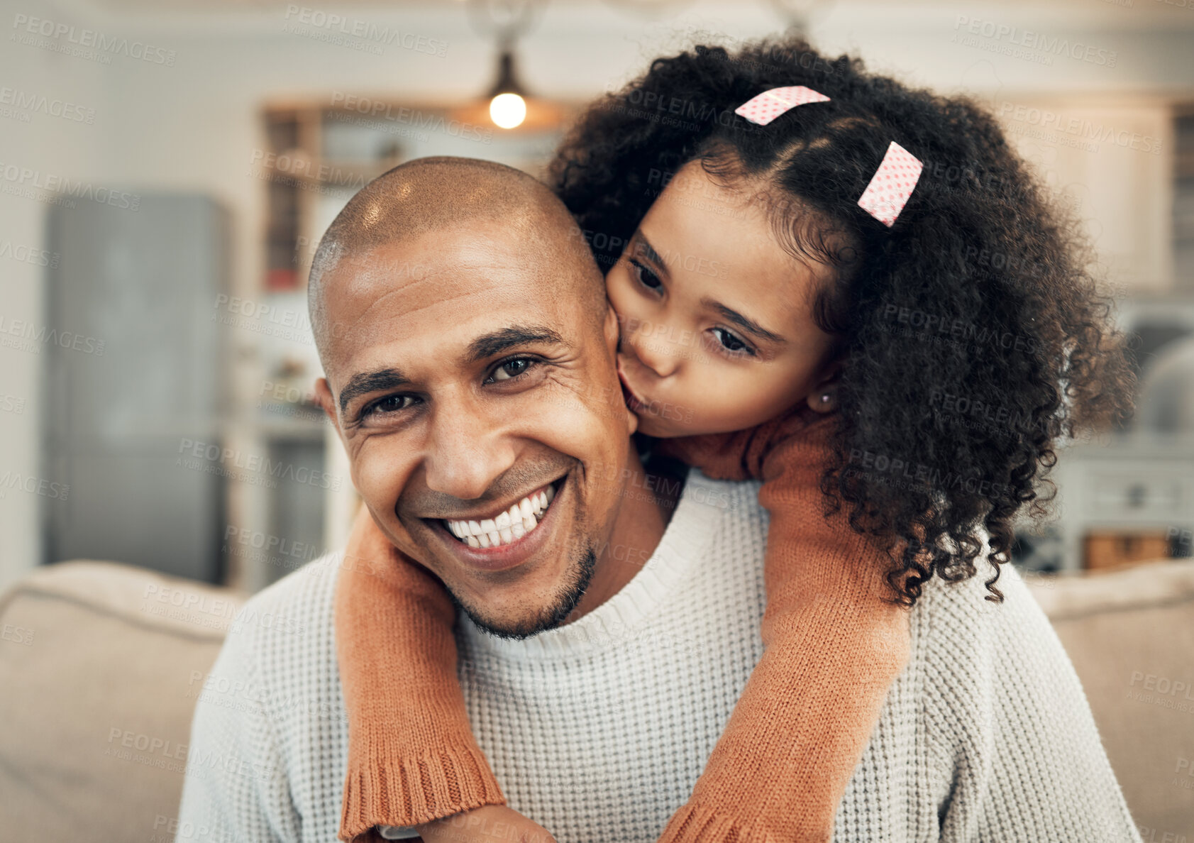 Buy stock photo Family, portrait and girl kiss father on sofa, happy and  playing or bond in their home. Piggyback, hug and face of parent with child on couch, sweet and embrace and having fun in living room