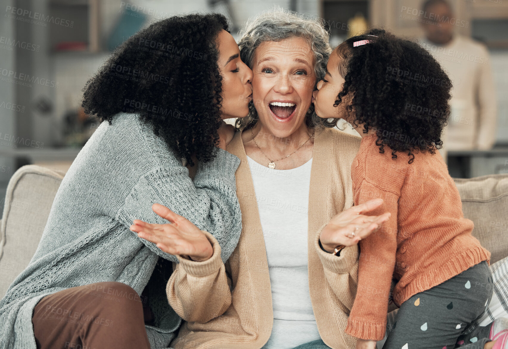 Buy stock photo Portrait, kiss and grandmother with girl and woman on a sofa, smile and happy at family home together. Kissing, face and excited senior with adult daughter and grandchild on couch, bond and joy