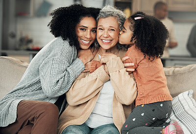 Buy stock photo Kiss, portrait and grandmother with girl and woman on a sofa, hug and happy in their home together. Kissing, face and excited senior woman with adult daughter and grandchild on couch, bond and smile