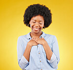 Black woman, happy and self love with hands on chest, peace and calm with eyes closed on yellow studio background. Female is content, wellness and care with mockup space, happiness and heart