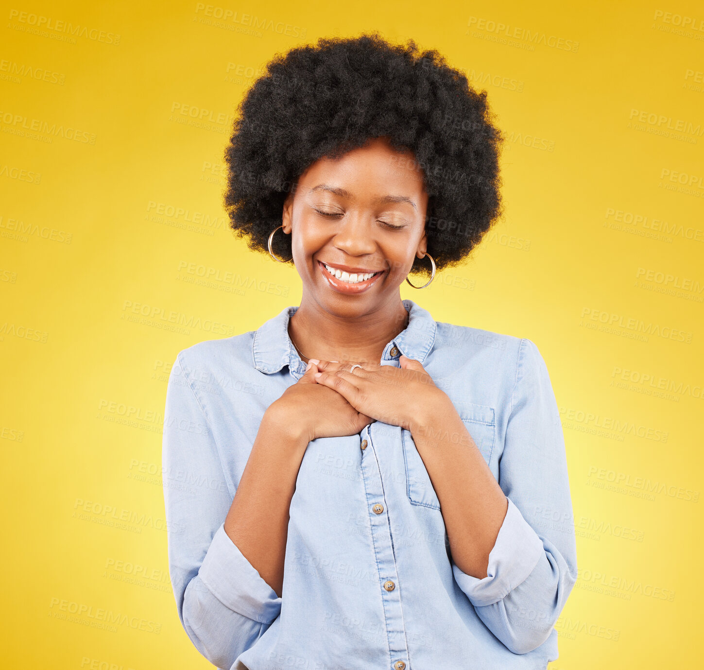 Buy stock photo Black woman, happy and self love with hands on chest for gratitude, peace and calm with eyes closed on yellow studio background. Content, wellness and care with mockup space, happiness and heart