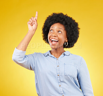 Buy stock photo Studio promotion, happy and black woman point at mock up space, advertising mockup or marketing promo. Commercial girl, gesture and excited person with product placement deal on yellow background 