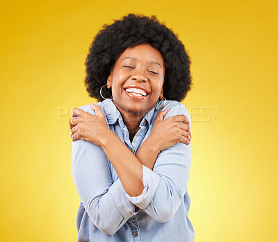 Buy stock photo Black woman, happy with self love and hug body, smile and joy with eyes closed on yellow studio background. Female is cheerful, wellness and positive mindset with mockup space, happiness and selfcare