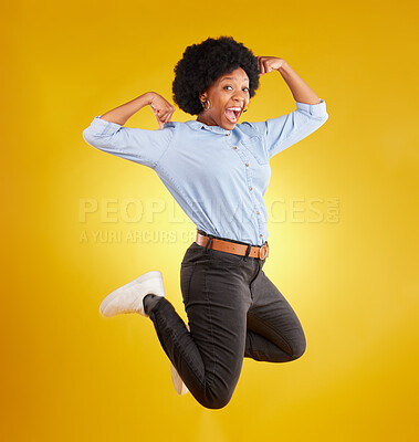 Buy stock photo Jump, muscle flex and portrait of black woman on yellow background with energy, happiness and smile in studio. Success mockup, celebration and isolated happy girl jumping for freedom, winning and joy