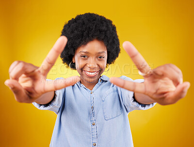 Buy stock photo Happy, peace sign and portrait of a black woman in studio with a positive and goofy mindset. Happiness, smile and African female model with an afro posing with chill hand gesture by yellow background