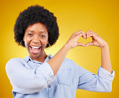 Buy stock photo Love, heart hands and portrait of black woman, smile and kindness isolated on yellow background. Motivation, support and loving hand gesture, like sign or emoji, happy African model in studio mockup.