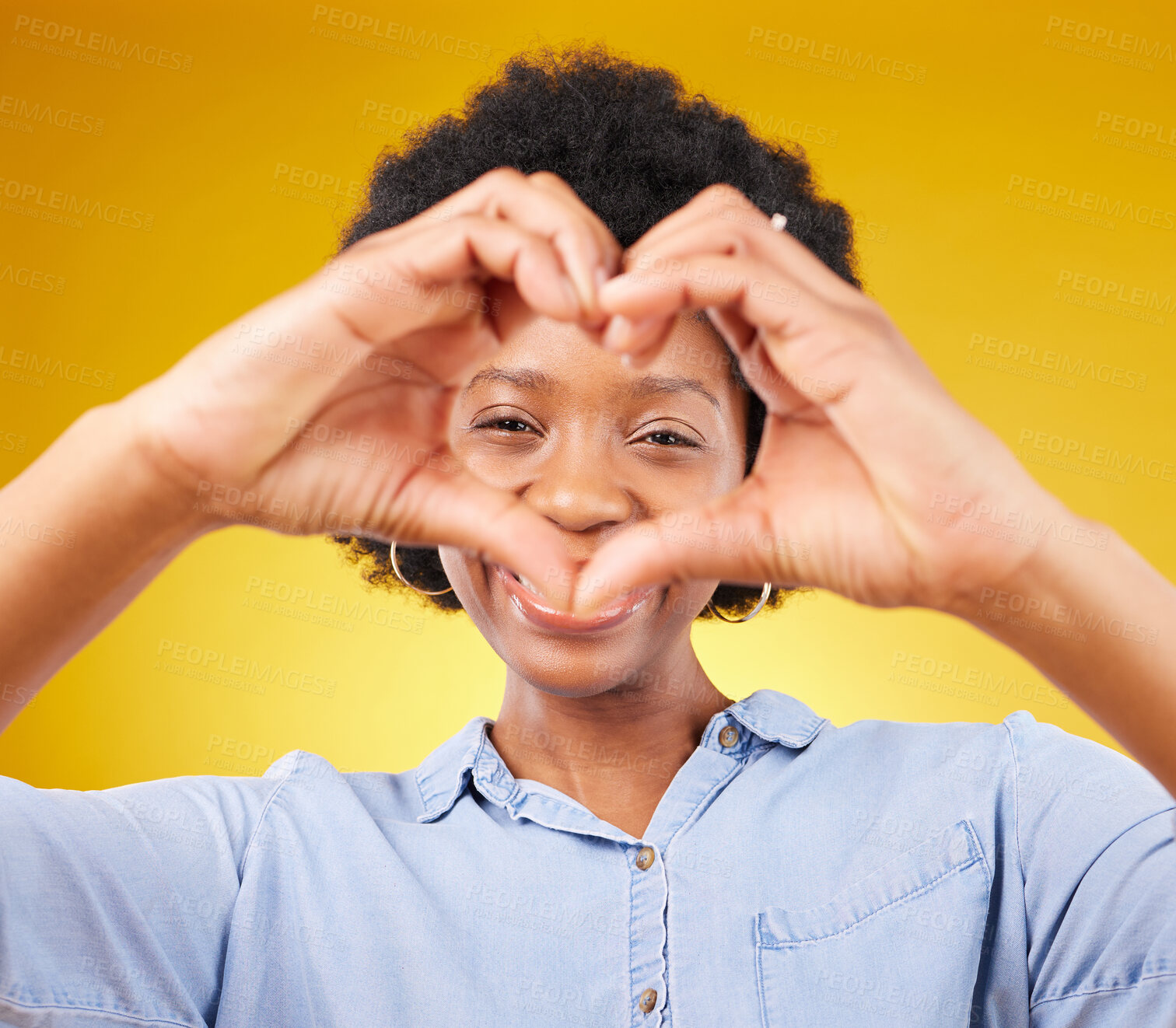 Buy stock photo Love, heart hands sign and portrait of black woman, smile and kindness isolated on yellow background. Motivation, support and loving hand gesture, happy African model in studio with caring mindset.