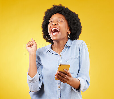 Buy stock photo Happy, excited and phone with black woman in studio for text message, notification and social media news. Deal, winner and celebration with girl on yellow background for offer, giveaway and surprise