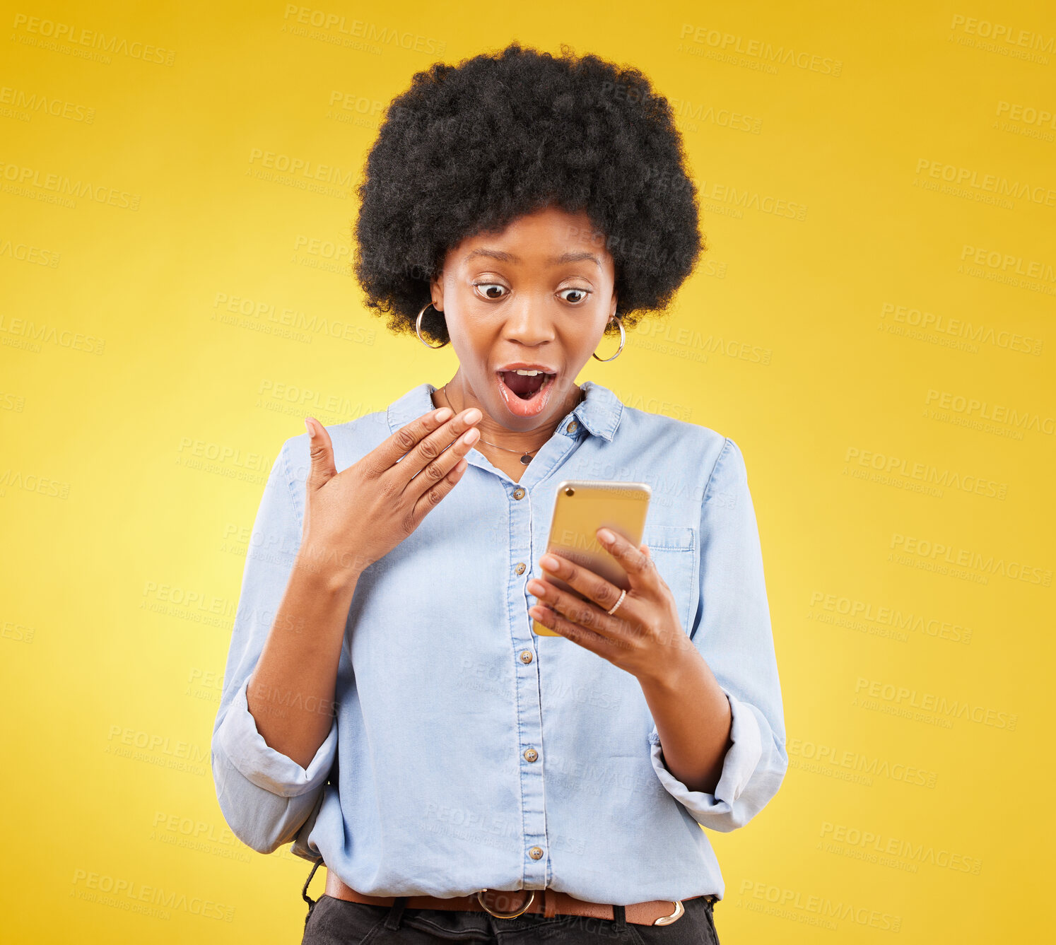 Buy stock photo Phone, surprise and wow of black woman in studio isolated on a yellow background. Shock, cellphone and surprised female with smartphone for good news on social media, winning lottery or competition.