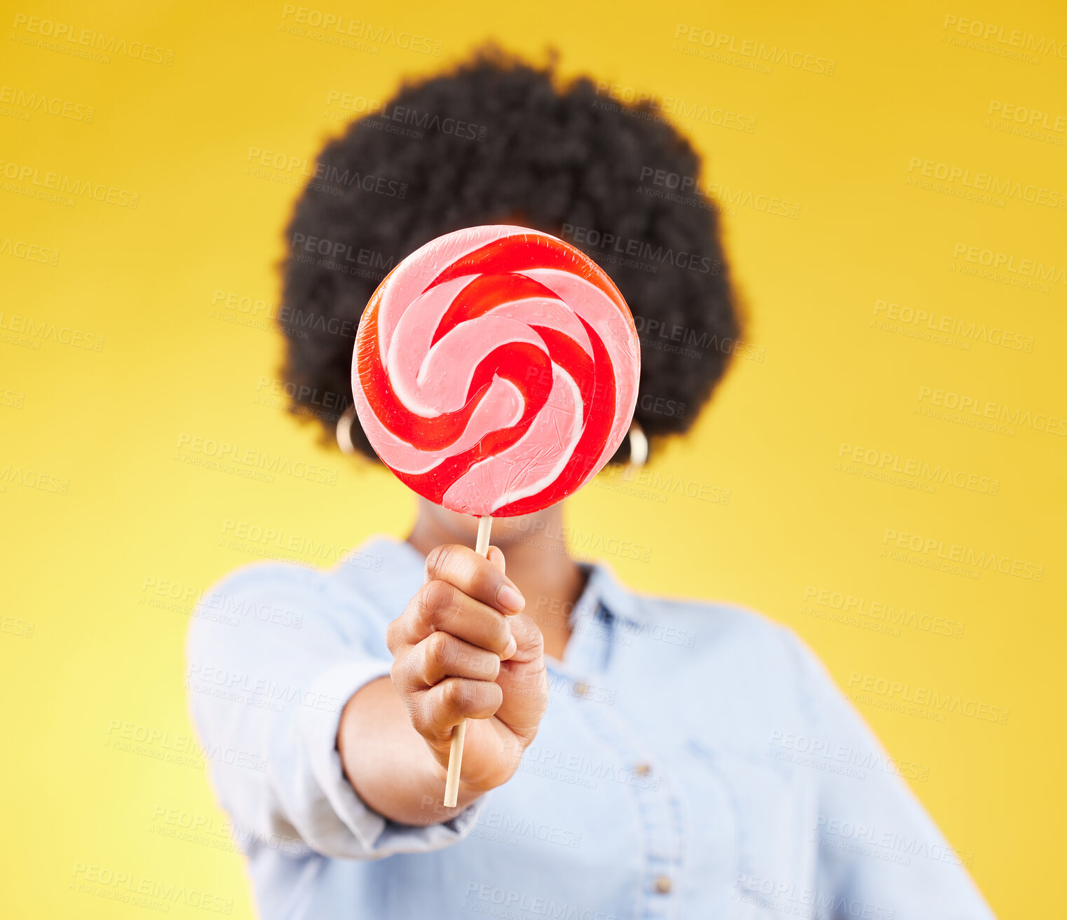 Buy stock photo Cover, candy and lollipop with black woman in studio for colorful, cheerful and positive. Young, sweets and dessert with female isolated on yellow background for treats, food and confectionary