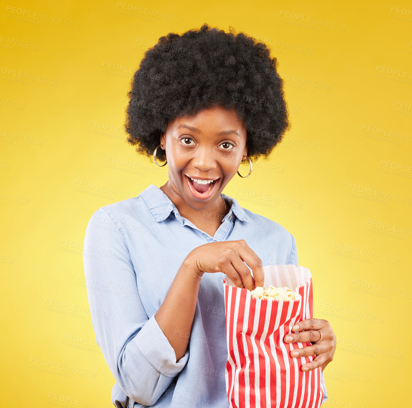 Buy stock photo Surprise, wow and popcorn with black woman in studio for movie, streaming service and cinema. Happy, comedy and theatre with female and snack isolated on yellow background for food, tv and film