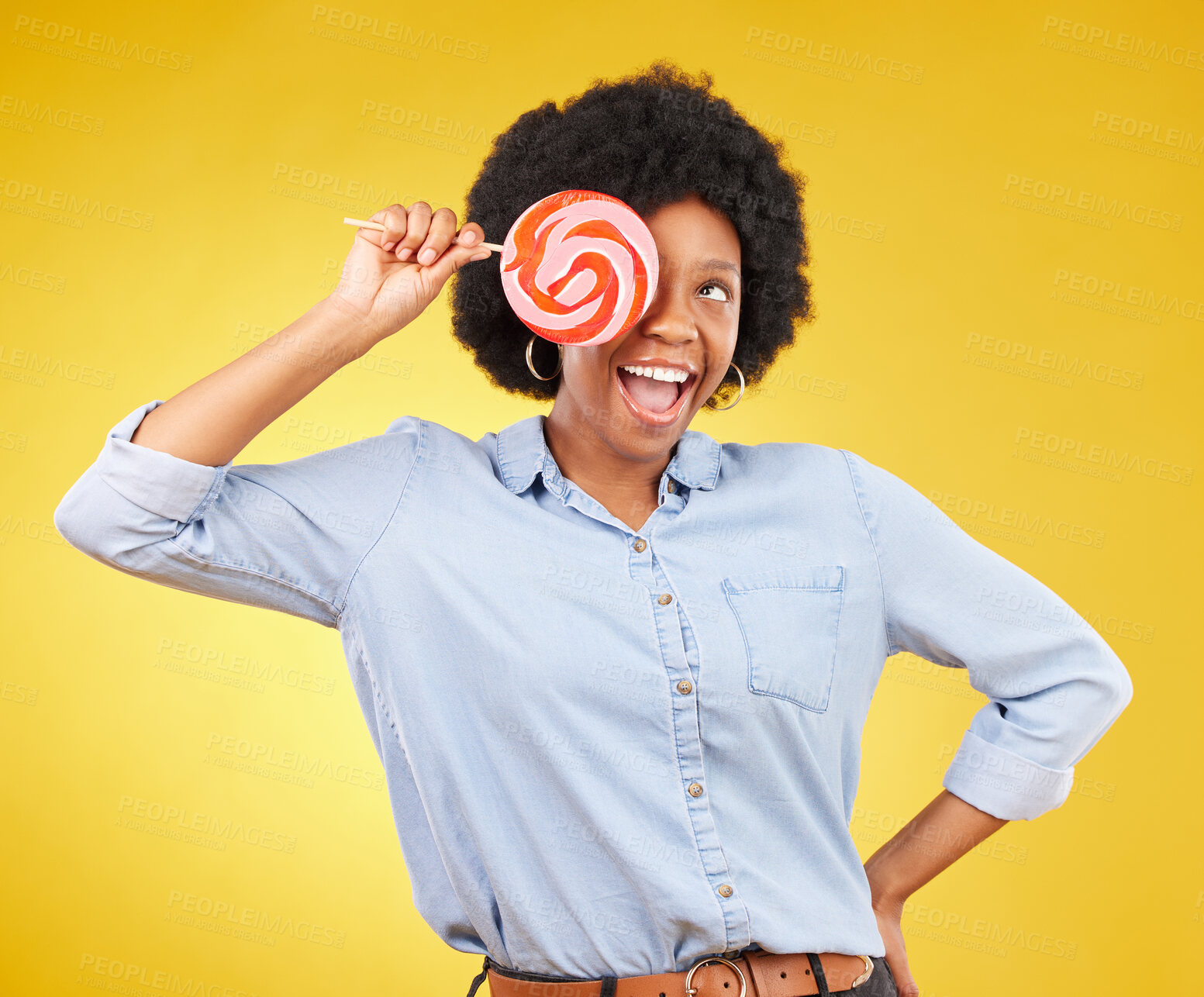 Buy stock photo Excited, candy and lollipop with black woman in studio for colorful, cheerful and positive. Young, happiness and dessert with female isolated on yellow background for treats, food and confectionary