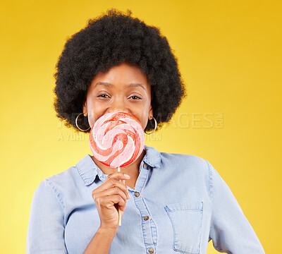 Buy stock photo Sweets, candy and lollipop with black woman in studio for colorful, cheerful and positive. Young, happiness and dessert with female isolated on yellow background for treats, food and confectionary