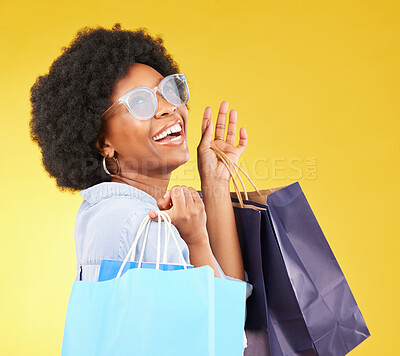 Buy stock photo Shopping bag, retail and happy black woman with sales product, discount fashion deal or mall store present. Commerce market, luxury designer gift or chic studio customer isolated on yellow background
