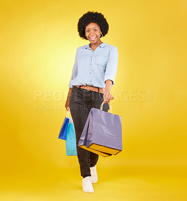 Buy stock photo Black woman with shopping bag, portrait with fashion and retail, smile on yellow studio background. Happiness, female with discount and sale at boutique with designer brand, happy and mockup space