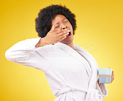 Buy stock photo Yawning, coffee and tired black woman in studio, waking up and sleepy on yellow background space. Exhausted, yawn and female with tea in bathrobe, emoji and fatigue gesture while posing isolated