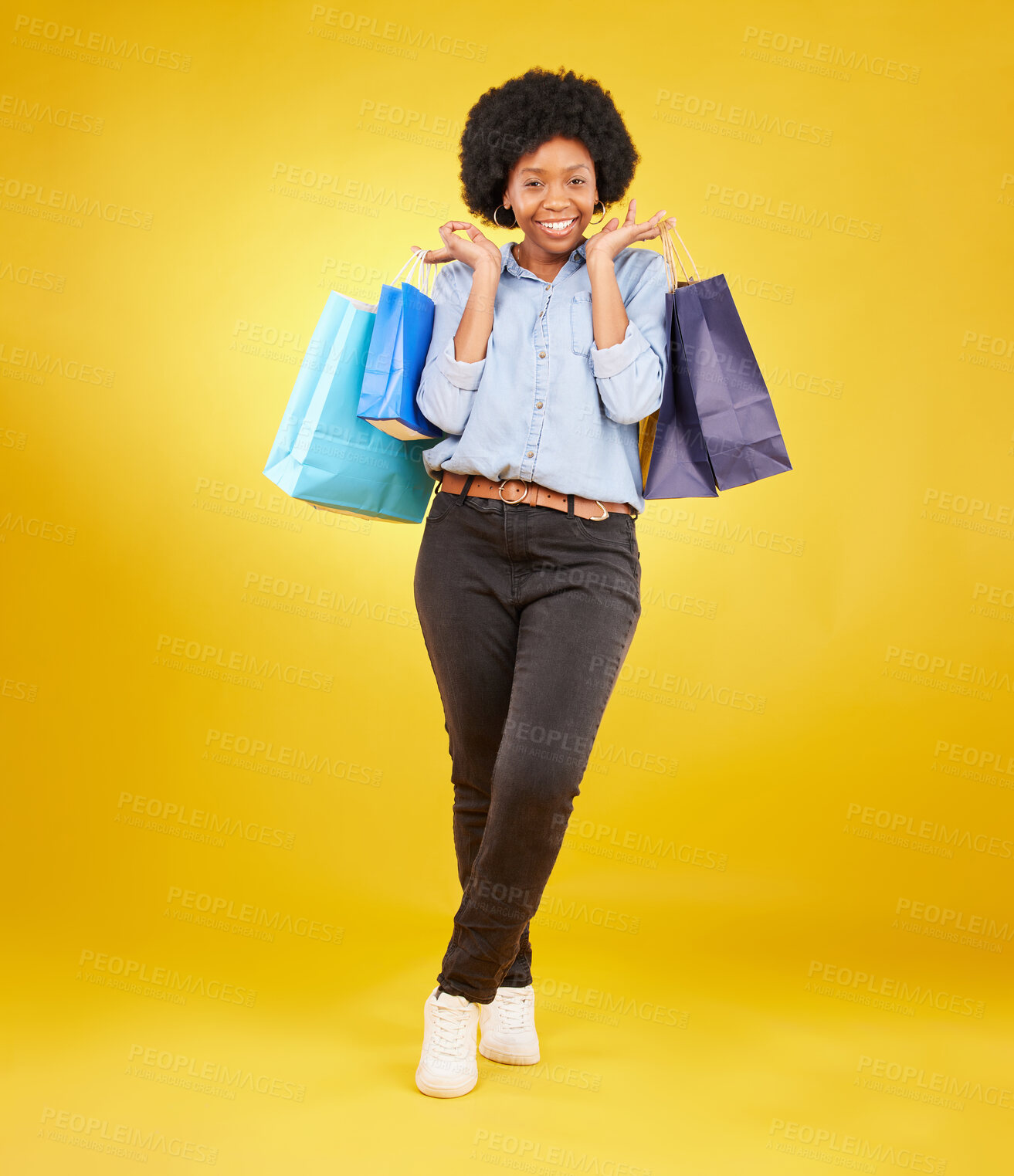 Buy stock photo Black woman with shopping bag, smile with fashion and retail in portrait on yellow studio background. Happiness, female with discount and sale at boutique with designer brand, happy and mockup space