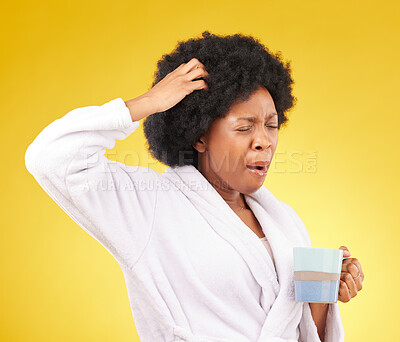 Buy stock photo Coffee, yawning and tired black woman in studio, waking up in the morning or sleepy isolated on a yellow background. Exhausted, insomnia and female scratching head with tea or caffeine in bathrobe.