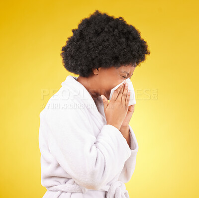 Buy stock photo Sick black woman, tissue and blowing nose with afro and morning gown against a studio background. Isolated African American female with cold, flu or symptoms for illness, covid or fever on mockup