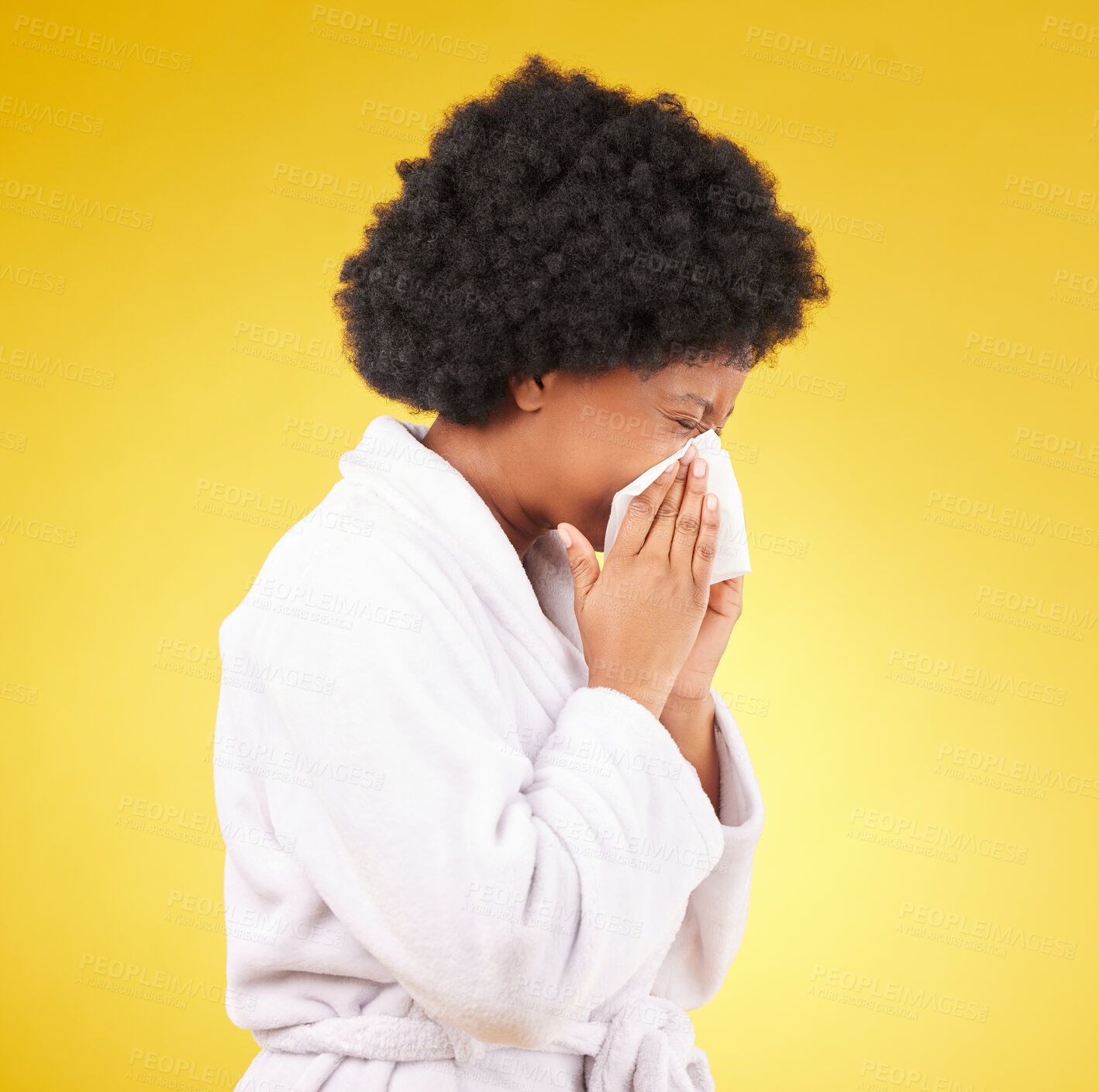 Buy stock photo Sick black woman, tissue and blowing nose with afro and morning gown against a studio background. Isolated African American female with cold, flu or symptoms for illness, covid or fever on mockup