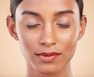 Buy stock photo Face, eyes closed or make up on model woman in studio isolated on beige background for skincare. Facial headshot, natural beauty or young Indian girl relaxing with glow or luxury self care cosmetics