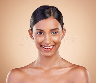 Buy stock photo Portrait, beauty and smile with a model woman in studio on a beige background for natural skincare. Face, happy and aesthetic with an attractive young female posing for cosmetics or luxury wellness