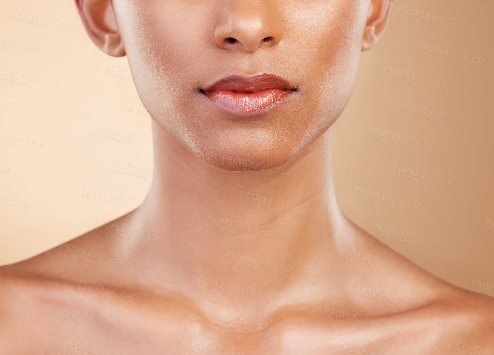 Buy stock photo Skincare, face and mouth of a woman with a glow isolated on a studio background. Beauty, makeup and a girl glowing from cosmetics, healthy skin and results from dermatology treatment on a backdrop