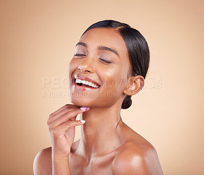 Buy stock photo Face, eyes closed or makeup on happy woman in studio isolated on beige background for skincare. Facial smile, natural beauty or funny Indian girl laughing with glow or luxury self care cosmetics
