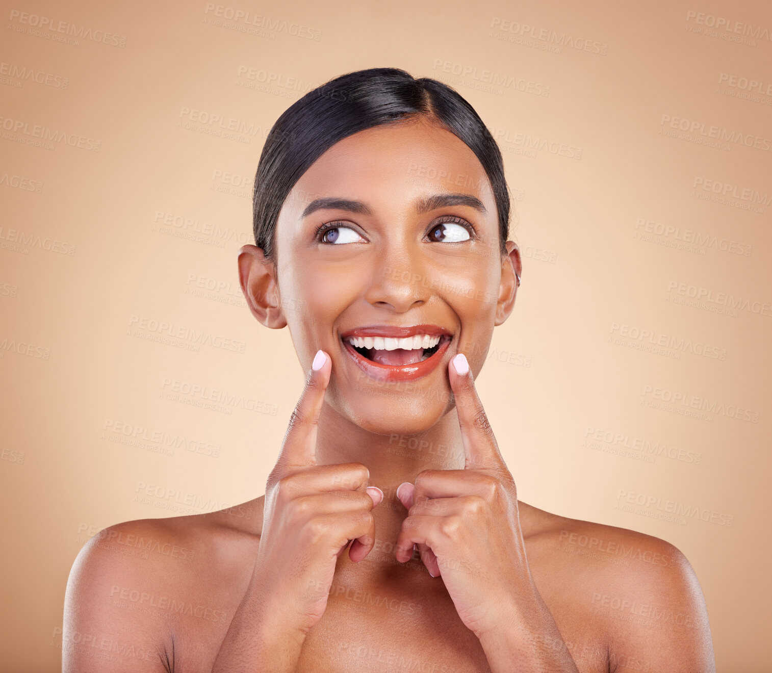 Buy stock photo Indian woman, skincare and hands for thinking in studio with face, smile and wellness by background. Young asian model, girl and cosmetics for natural skin glow, aesthetic or happiness for idea