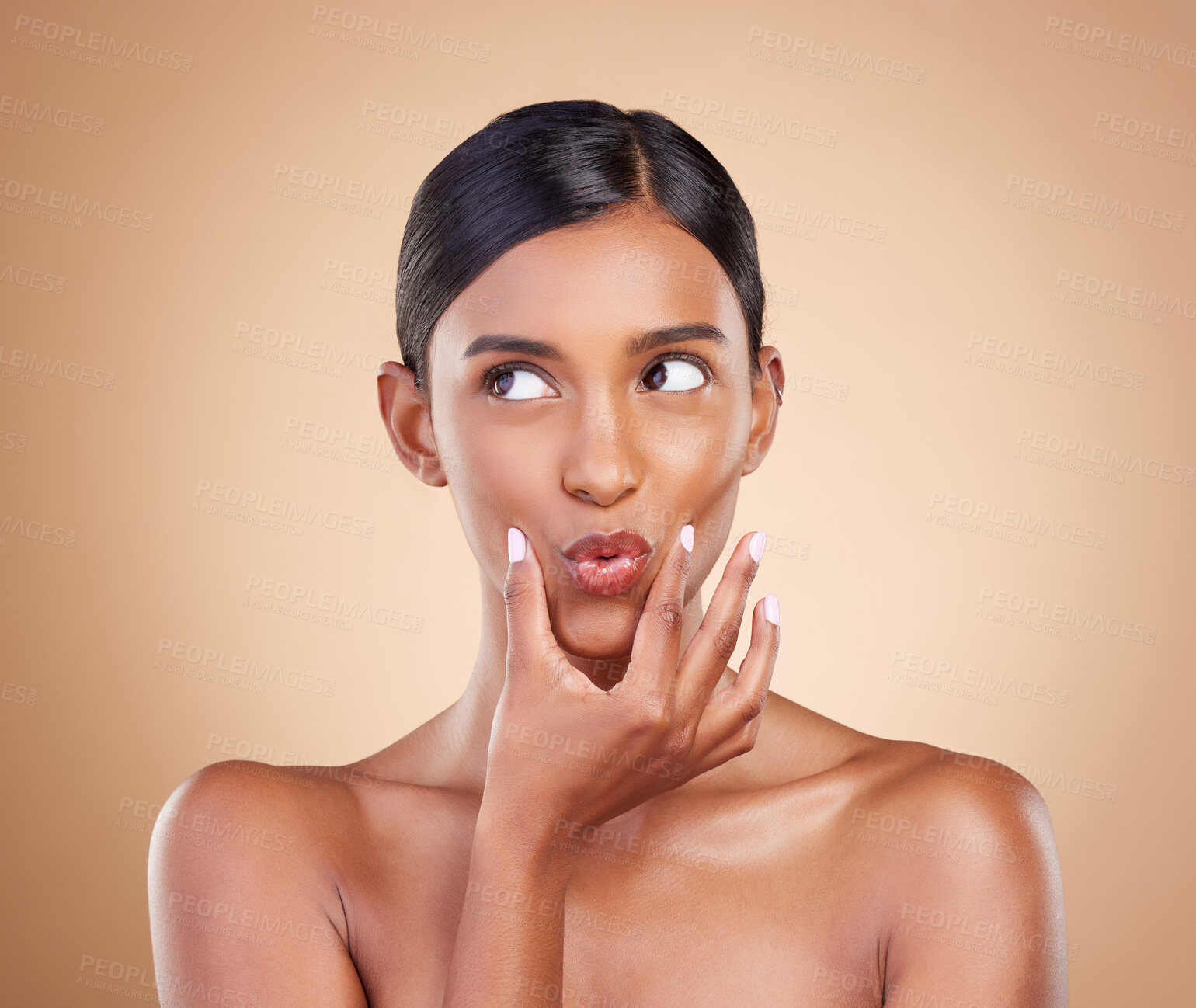 Buy stock photo Pout, beauty and Indian woman with skincare, makeup and cosmetic glow and clear skin isolated in a studio brown background. Thinking, self care and face of natural female model with facial routine