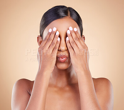 Buy stock photo Beauty, pout and woman covering eyes for skincare, self care and cosmetic facial isolated in brown studio background. Dermatology, person and model with hands on face for morning routine