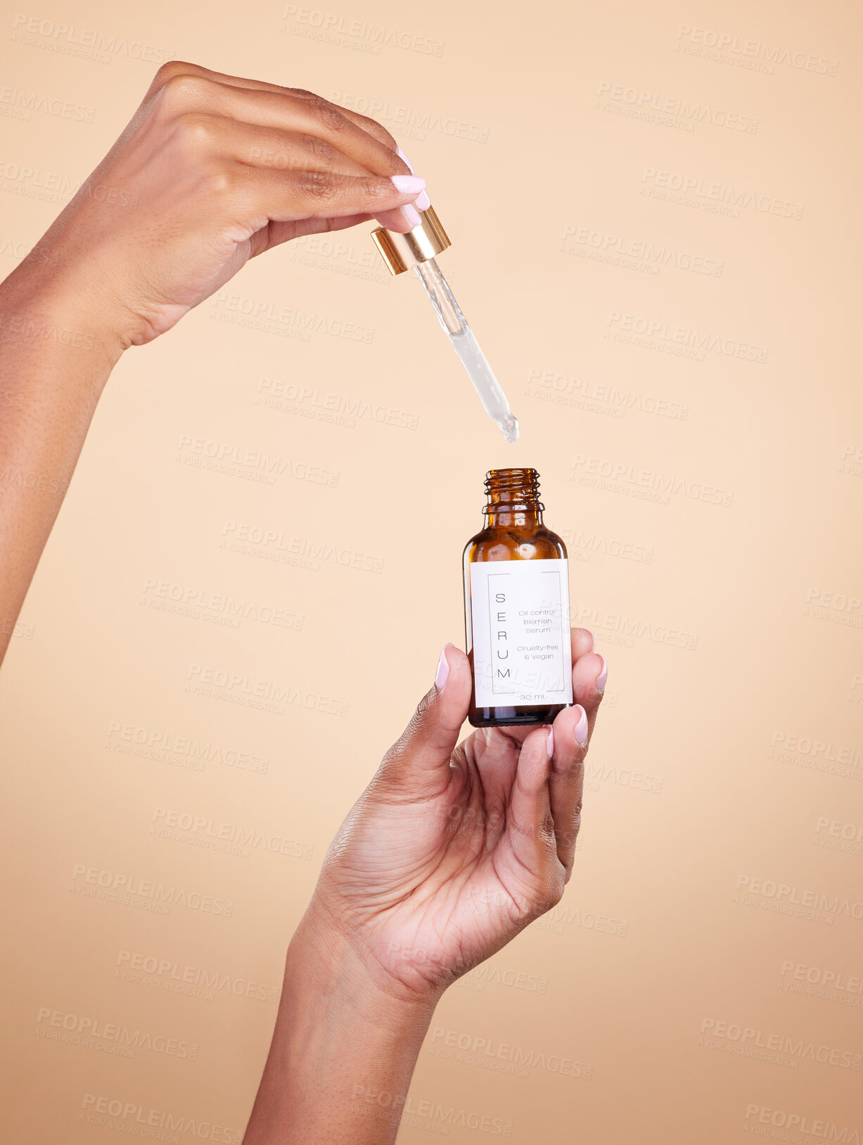 Buy stock photo Hands, serum and pipette with bottle product in studio isolated on brown background. Skincare, dermatology and woman model with cruelty free hyaluronic acid, vegan retinol or essential oil cosmetics.