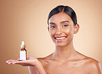 Portrait, skincare and serum with a model woman in studio on a beige background to promote beauty. Face, product and antiaging with an attractive young female posing for cosmetics or luxury wellness