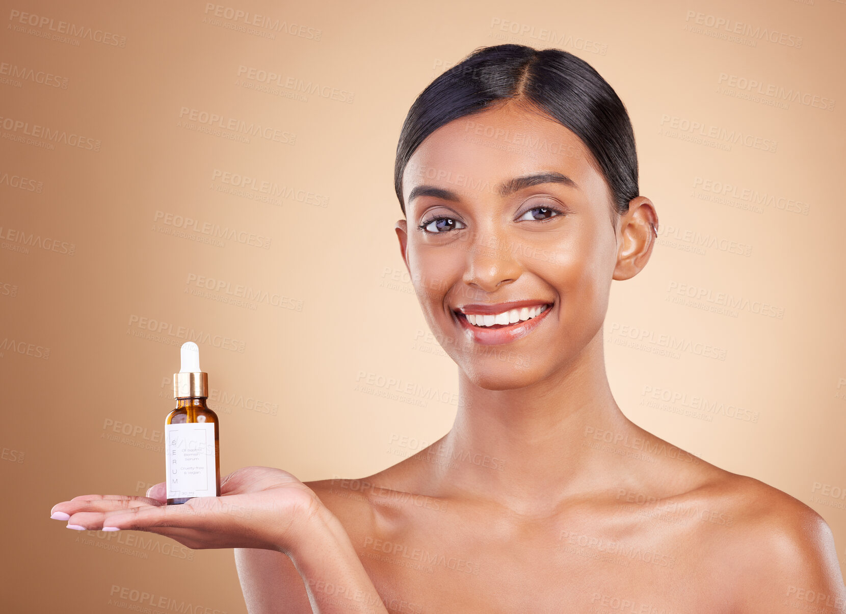 Buy stock photo Portrait, skincare and serum with a model woman in studio on a beige background to promote beauty. Face, product and antiaging with an attractive young female posing for cosmetics or luxury wellness