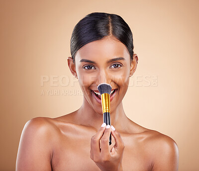 Buy stock photo Portrait, makeup brush and blush with a model woman in studio on a beige background to promote beauty. Face, nose and blusher with an attractive young female posing for cosmetics or luxury wellness