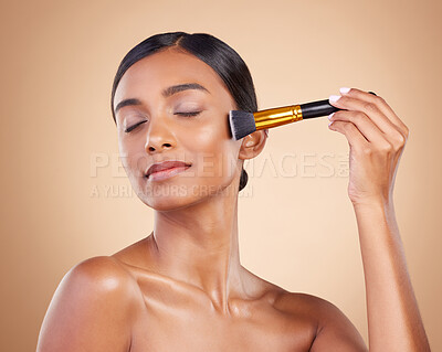 Buy stock photo Woman, brush or makeup artist with beauty, cosmetic products or self care in studio background. Eyes closed, model face or relaxed young Indian girl with cosmetics, glowing skincare or application 