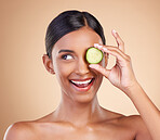 Smile, beauty or happy woman with cucumber for cleaning, detox and healthy facial treatment routine. Wellness, face or Indian girl with skincare nutrition or cosmetics isolated on studio background