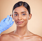 Portrait, smile or Indian woman with injection for botox, plastic surgery or medical cosmetics in studio. Skincare, dermatology or hand with needle for face lift or facial treatment on happy girl