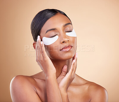 Buy stock photo Face, beauty or girl with eye patch for skincare or wellness isolated on studio background. Cosmetics or Indian woman with facial collagen pads or dermatology product for anti aging or dark circles