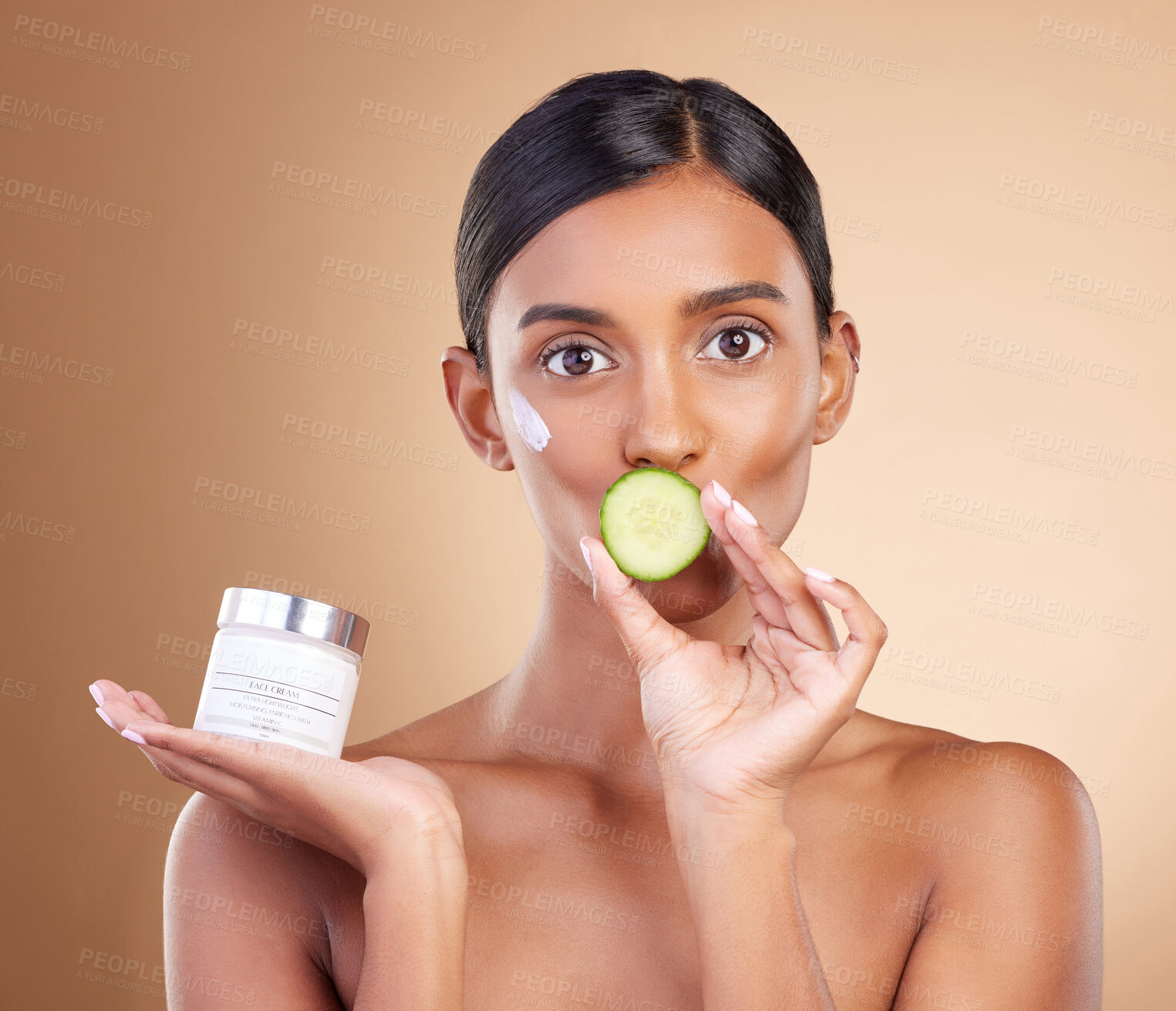 Buy stock photo Woman, moisturizer cream and cucumber for natural skincare, beauty and nutrition against studio background. Portrait of female holding vegetable, creme or lotion for healthy organic diet or wellness