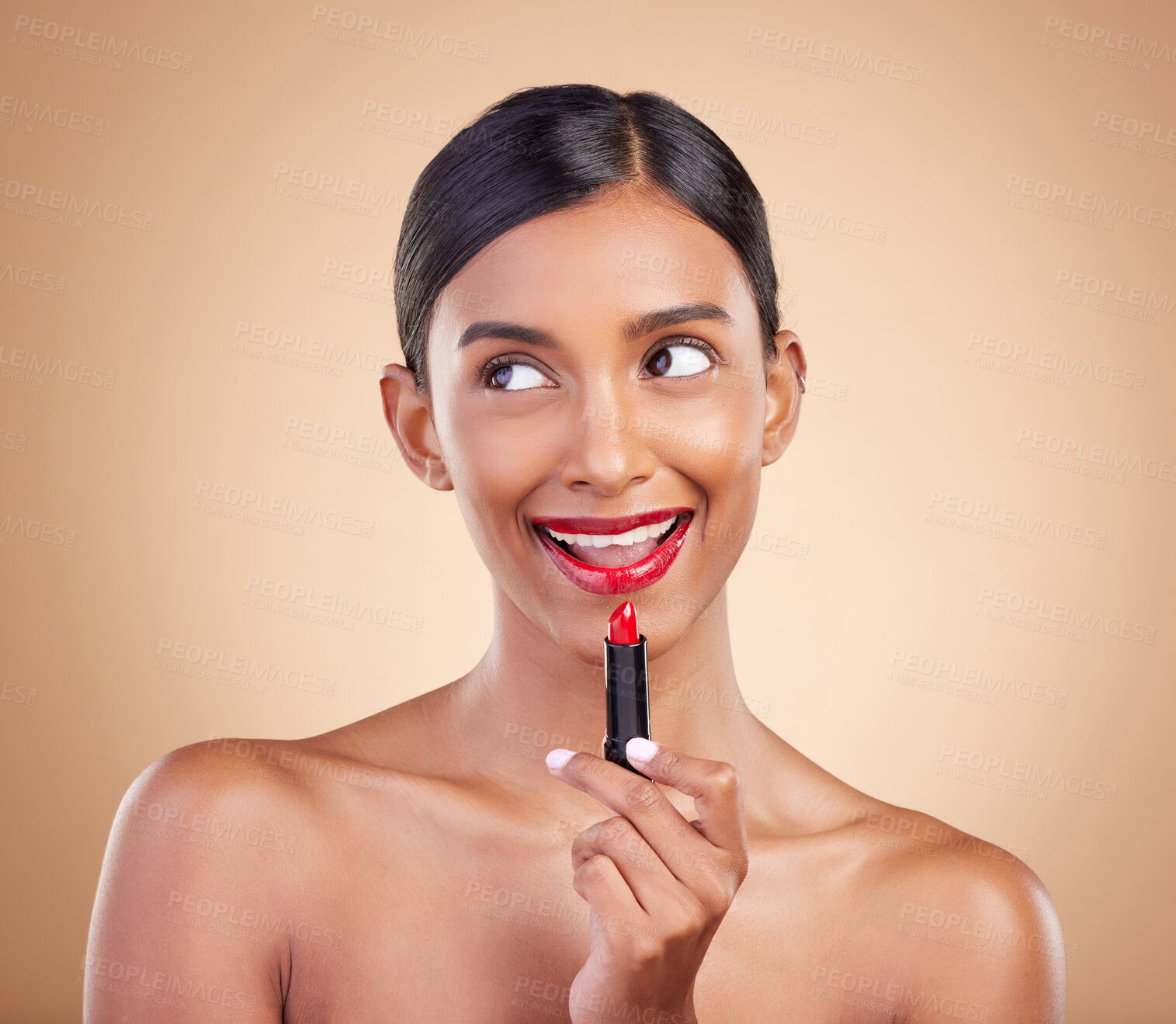 Buy stock photo Makeup, red lipstick and beauty of a woman in studio for cosmetics, face glow and shine product. Indian female model thinking on beige background about skin, facial self care and lips with color idea