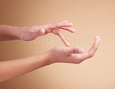 Buy stock photo Hands, manicure and palm beauty of female model with cosmetic care, skincare or self care isolated in brown studio background. Polish, shine and nails with natural glow and healthy skin