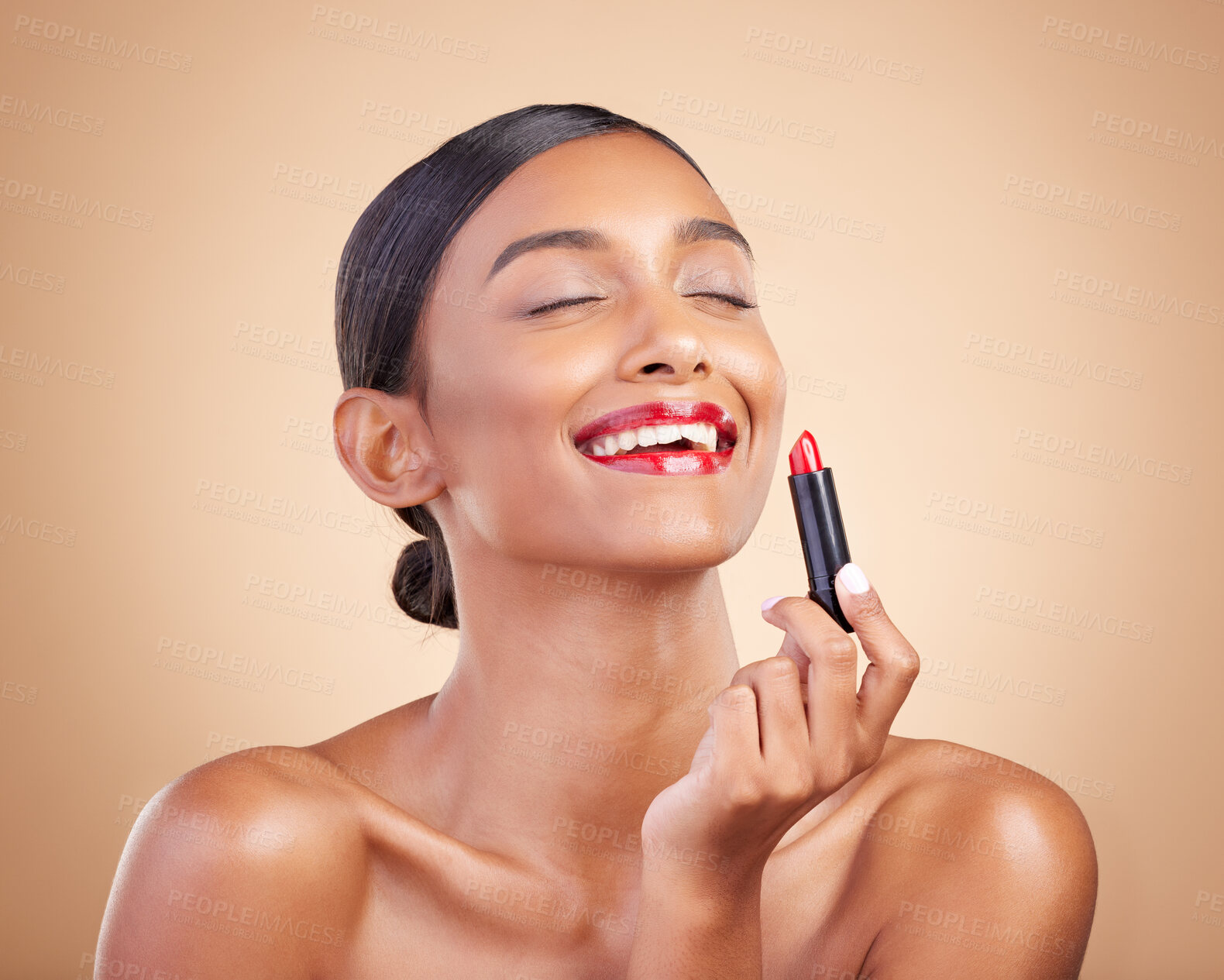 Buy stock photo Beauty, makeup and woman with lipstick, dermatology and happiness against a brown studio background. Happy, female and lady with cosmetics, aesthetic and confidence with grooming, red gloss and smile