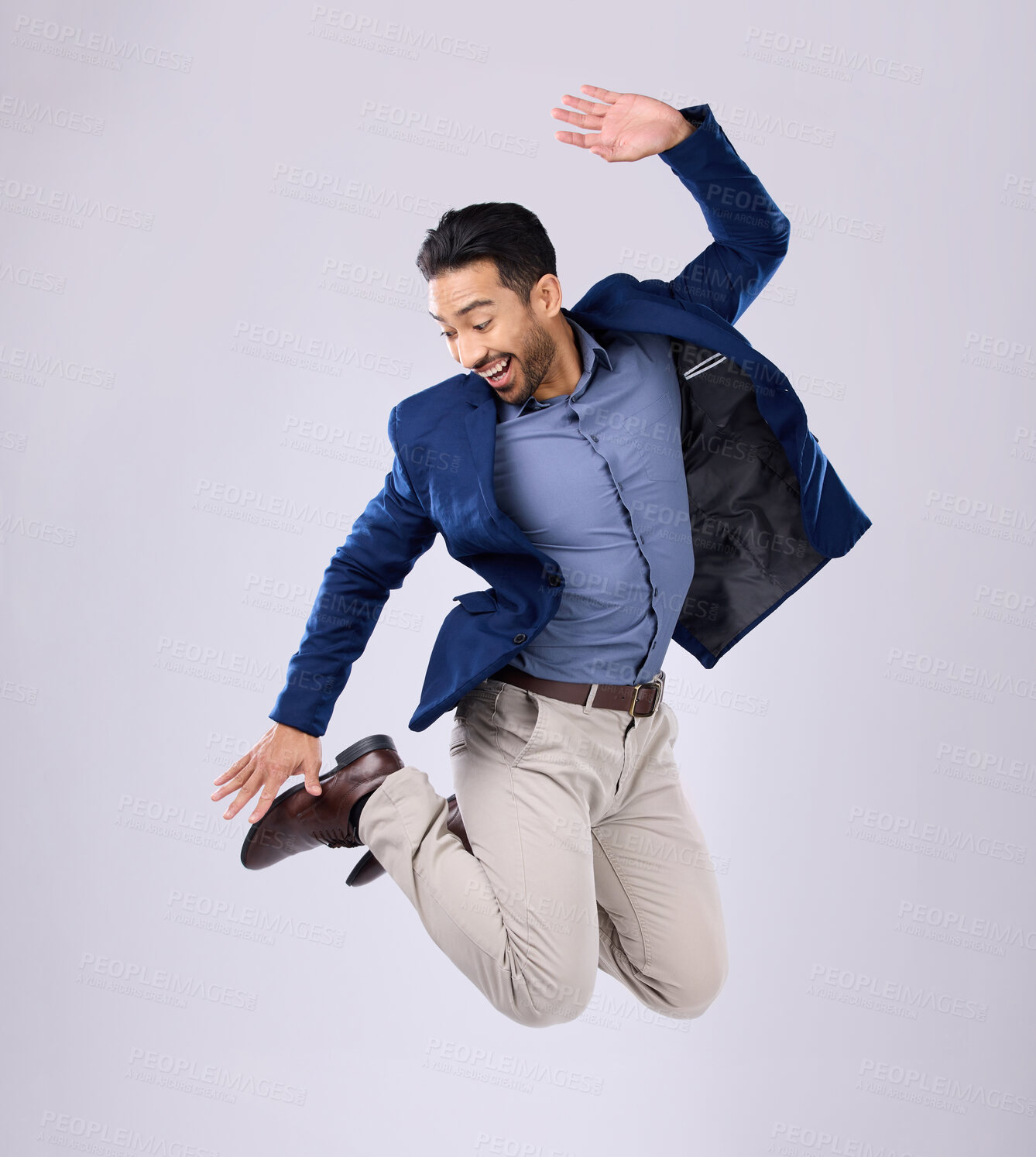 Buy stock photo Businessman, excited and jumping in studio with happy smile with winning expression on white background. Freedom, success and jump, Indian man with energy and motivation in celebration of winner deal