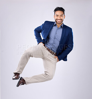 Buy stock photo Happy, freedom and portrait of an Asian man jumping isolated on a white background in a studio. Excited, smile and a Japanese businessman in the air for excitement, energy and ecstatic on a backdrop