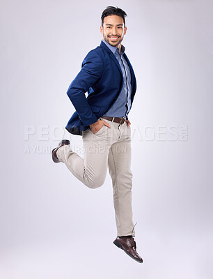 Buy stock photo Jump, happy and portrait of man in studio with positive mindset, happiness and joy on white background. Winner, success mockup and isolated male jumping with smile for energy, freedom and confidence