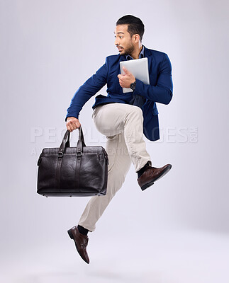 Buy stock photo Late, work and an Asian man jump for business isolated on a white background in a studio. Fast, serious and a corporate Japanese businessman running in the air while rushing to the workplace