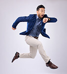 Wristwatch, jump and Asian man late, appointment and employee against a grey studio background. Male manager, consultant and employee with schedule, deadline and stress with clock, jump and movement